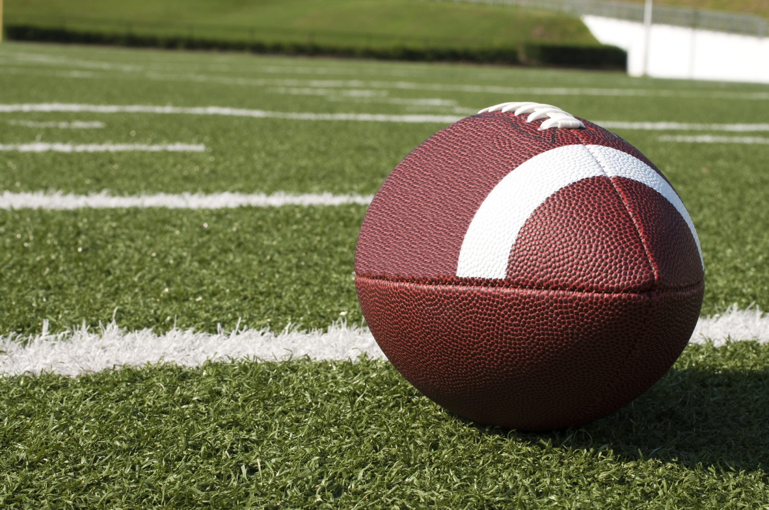 An American football on the field.