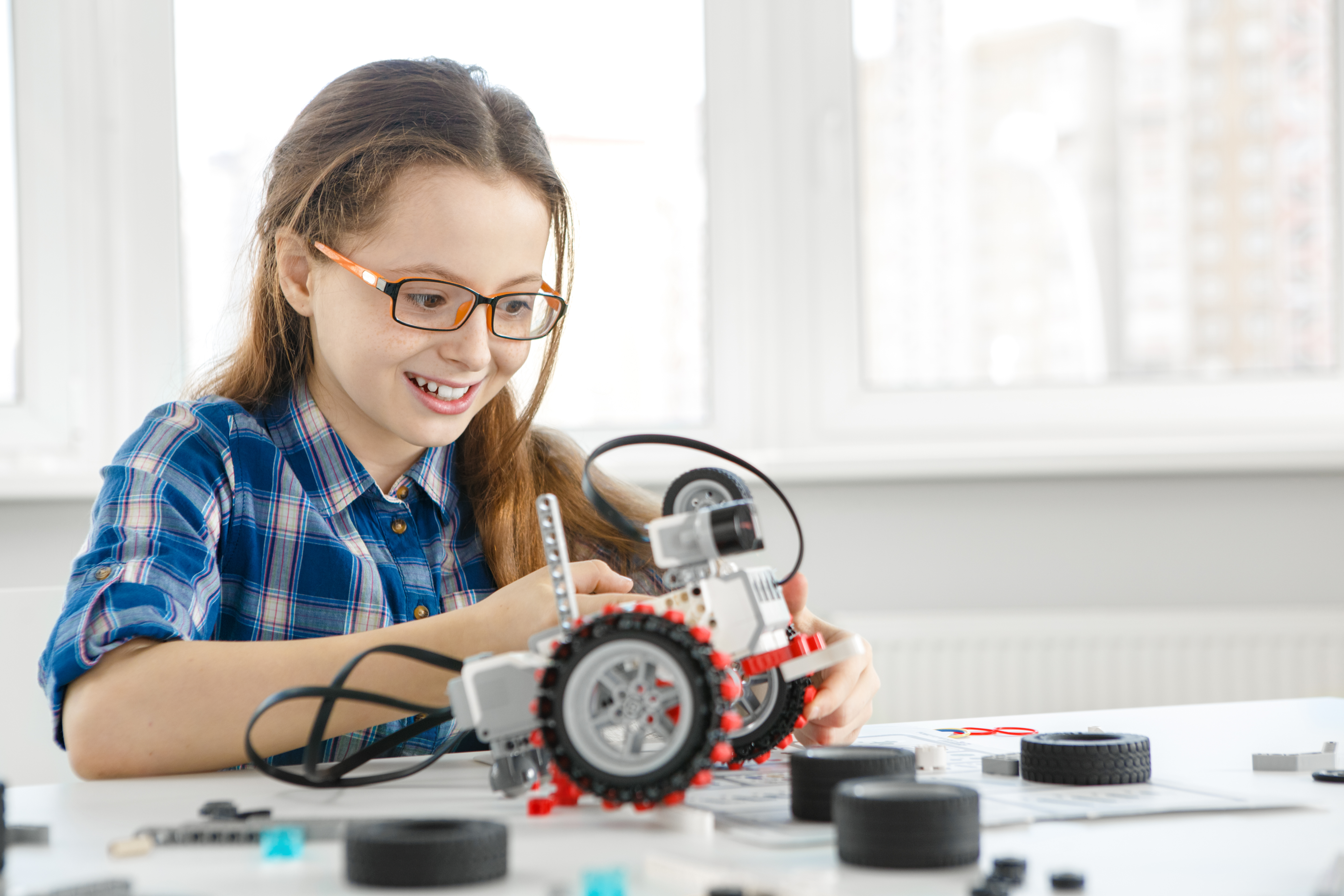 Girl building robot